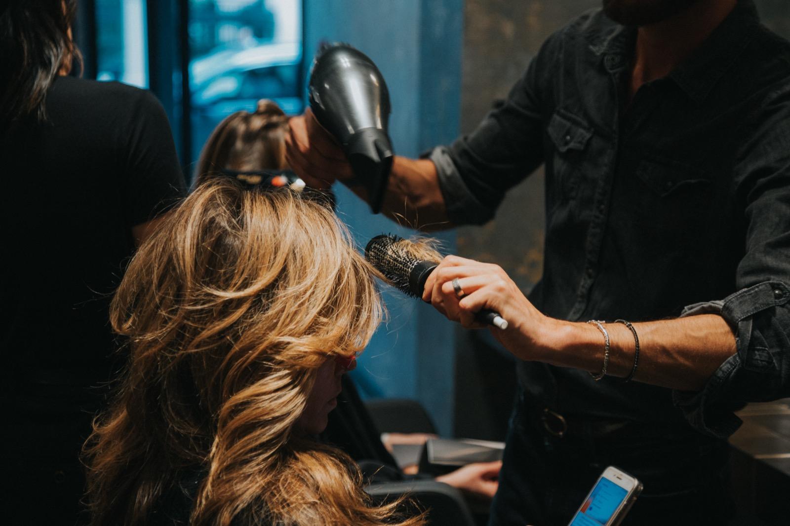 Professional blowdry styling in action at GA Salons showing stylist using professional equipment